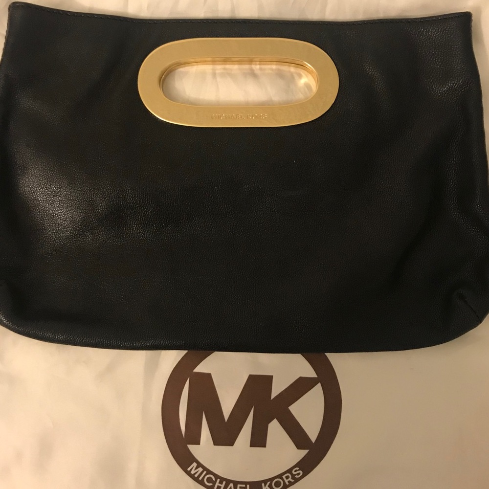 Authentic Michael kors black and gold clutch